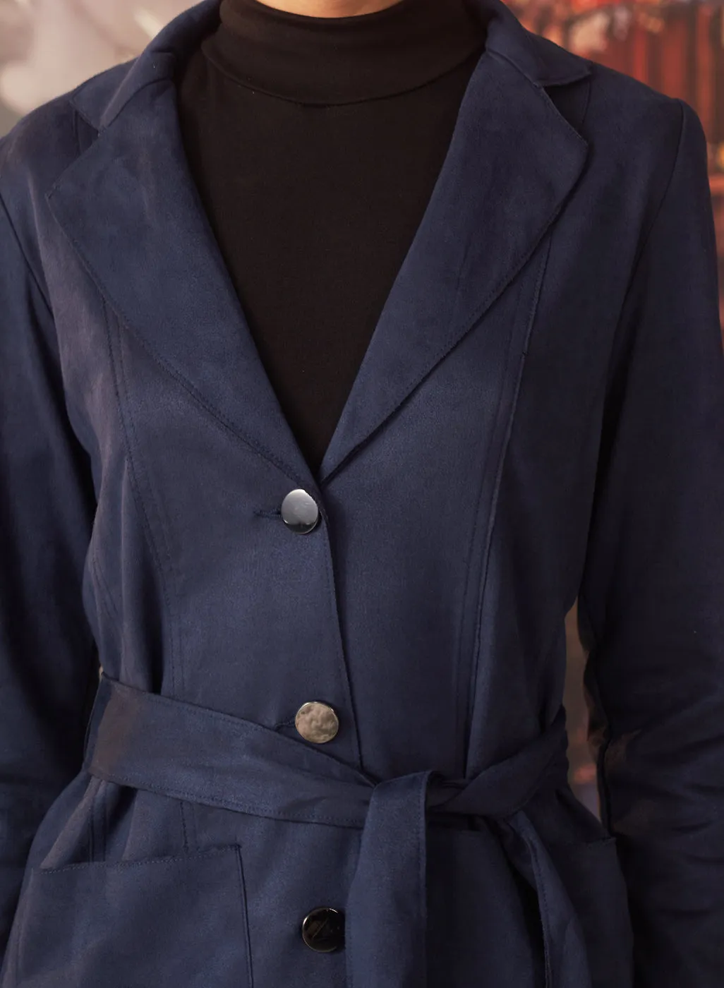 Navy button up suede coat with lapel collar and belt